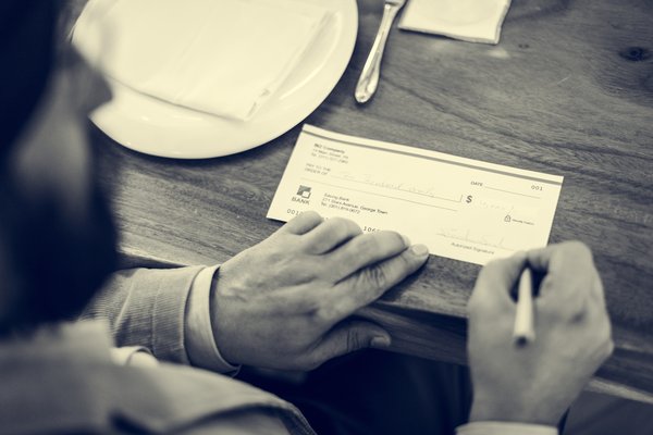 business-people-cheque-money-concept-2023-11-27-05-24-57-utc