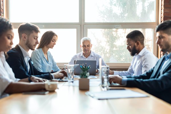 colleagues-working-during-corporate-meeting-sittin-2023-11-27-05-23-43-utc