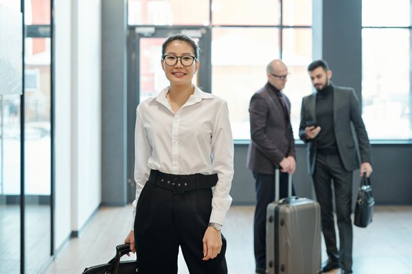 happy young successful female business traveler